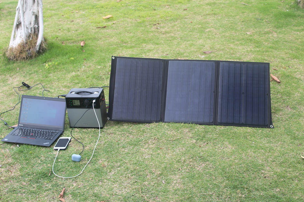 portable <a href=https://www.cnsolarcharger.com/products-5-9-p.html target='_blank'>foldable solar panels</a> solar outdoor kit charging laptop, mobilephone and bluetooth earplug